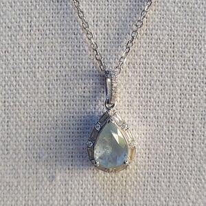 Oval Aquamarine and 0.19 Diamond Halo Pendant Necklace In 10K White Gold